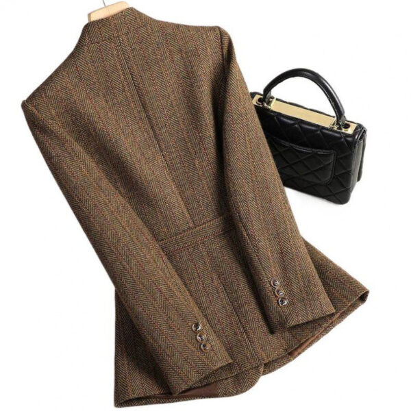 Brown herringbone coat with black handbag.