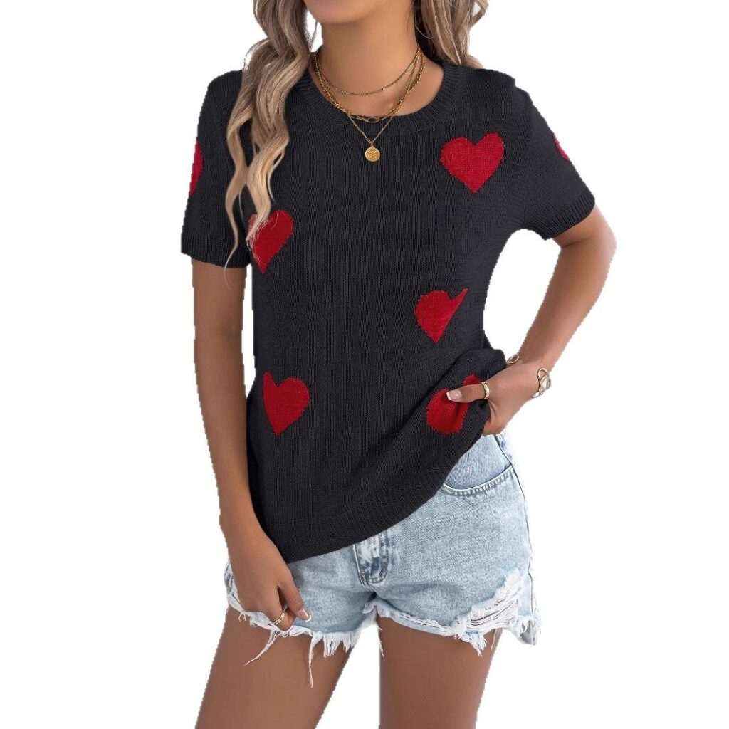 Woman wearing heart-patterned shirt and shorts.