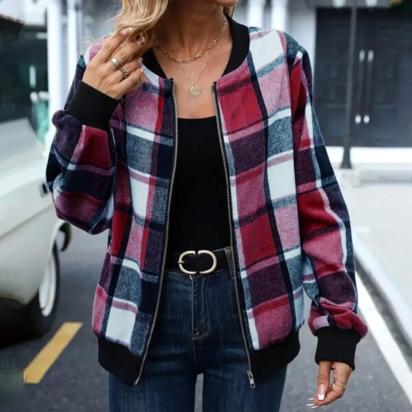 Woman wearing plaid jacket and jeans.