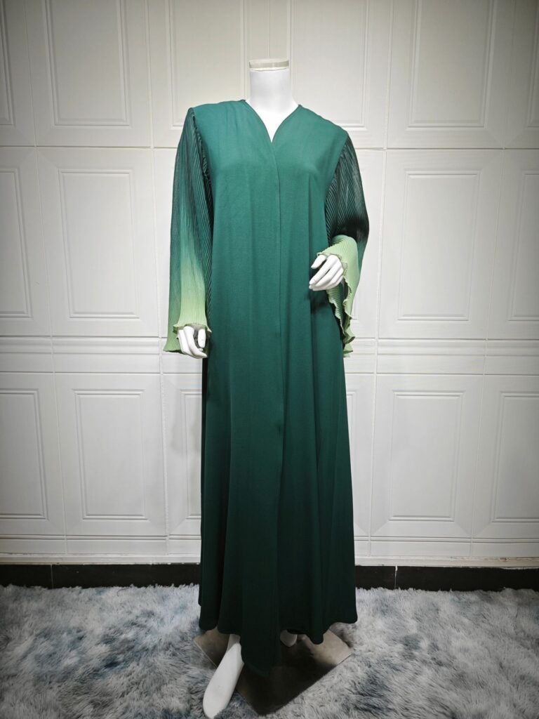 Green long-sleeve dress on mannequin display.