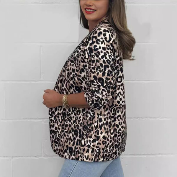 Woman wearing leopard print jacket, smiling.
