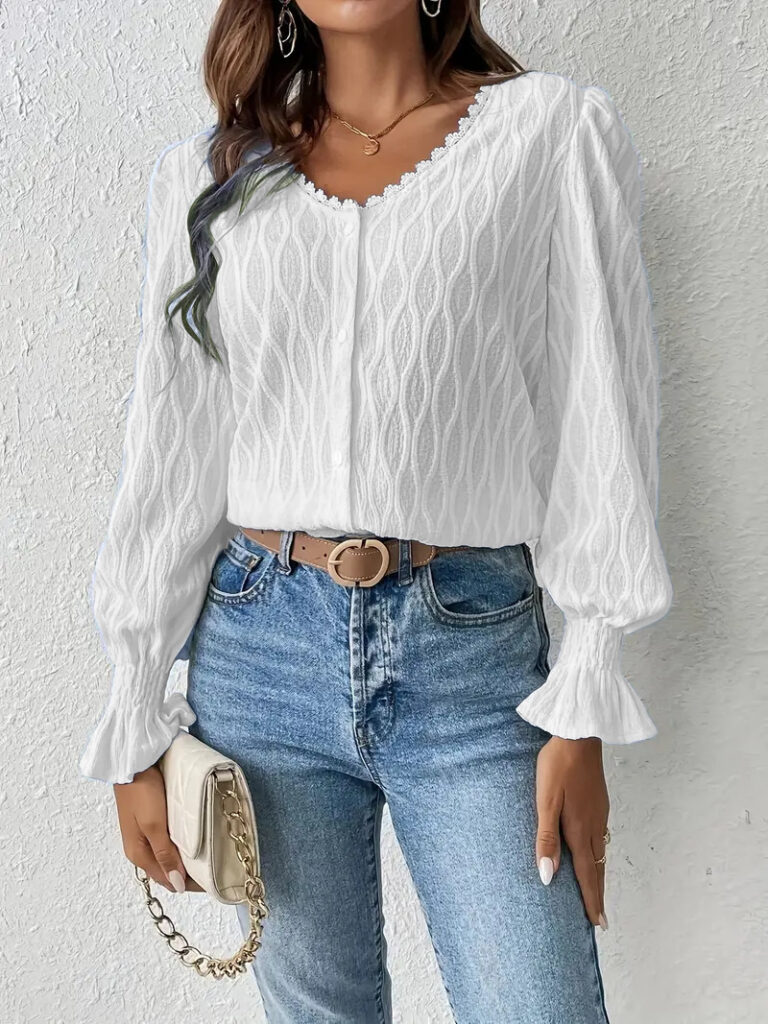 Woman in white blouse and jeans.