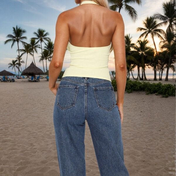 Woman on tropical beach at sunset.
