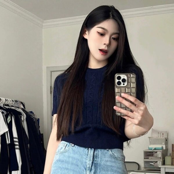 Person taking a mirror selfie at home.