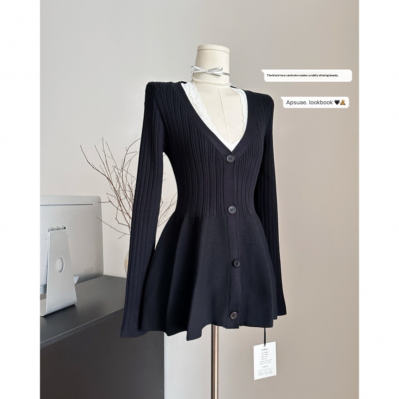 Black buttoned cardigan on a mannequin.