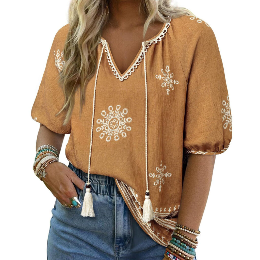 Woman in embroidered blouse and denim jeans.