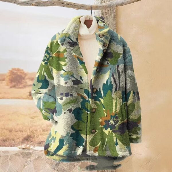 Floral-patterned coat on hanger near window.