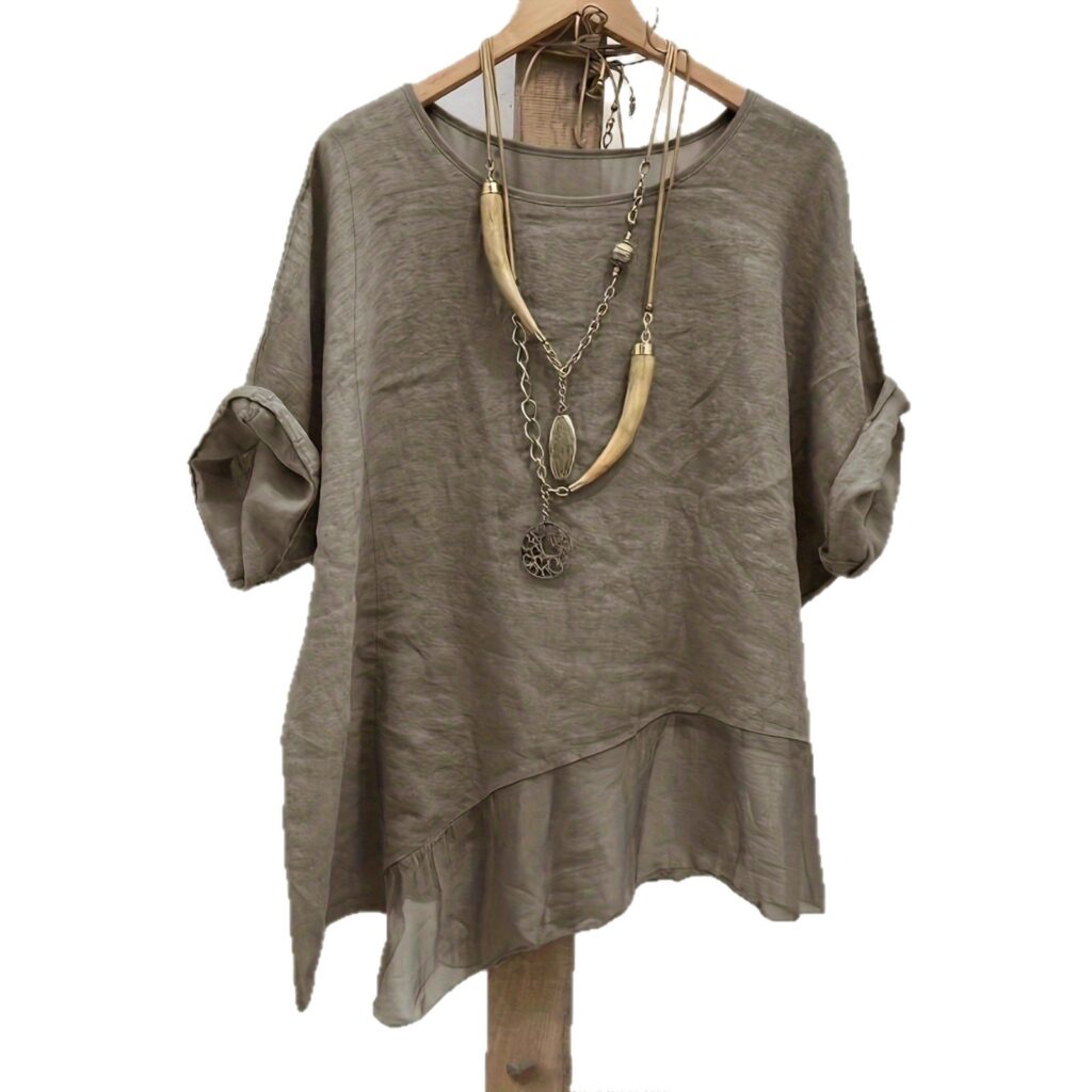 Gray shirt with long necklace on hanger.