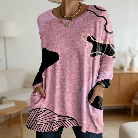 Pink abstract-patterned sweater in cozy room.