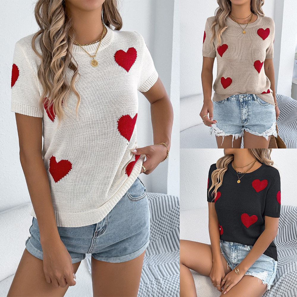 Women in heart-patterned sweaters and shorts.