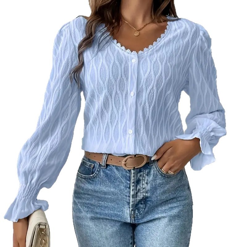 Woman in blue blouse and jeans.