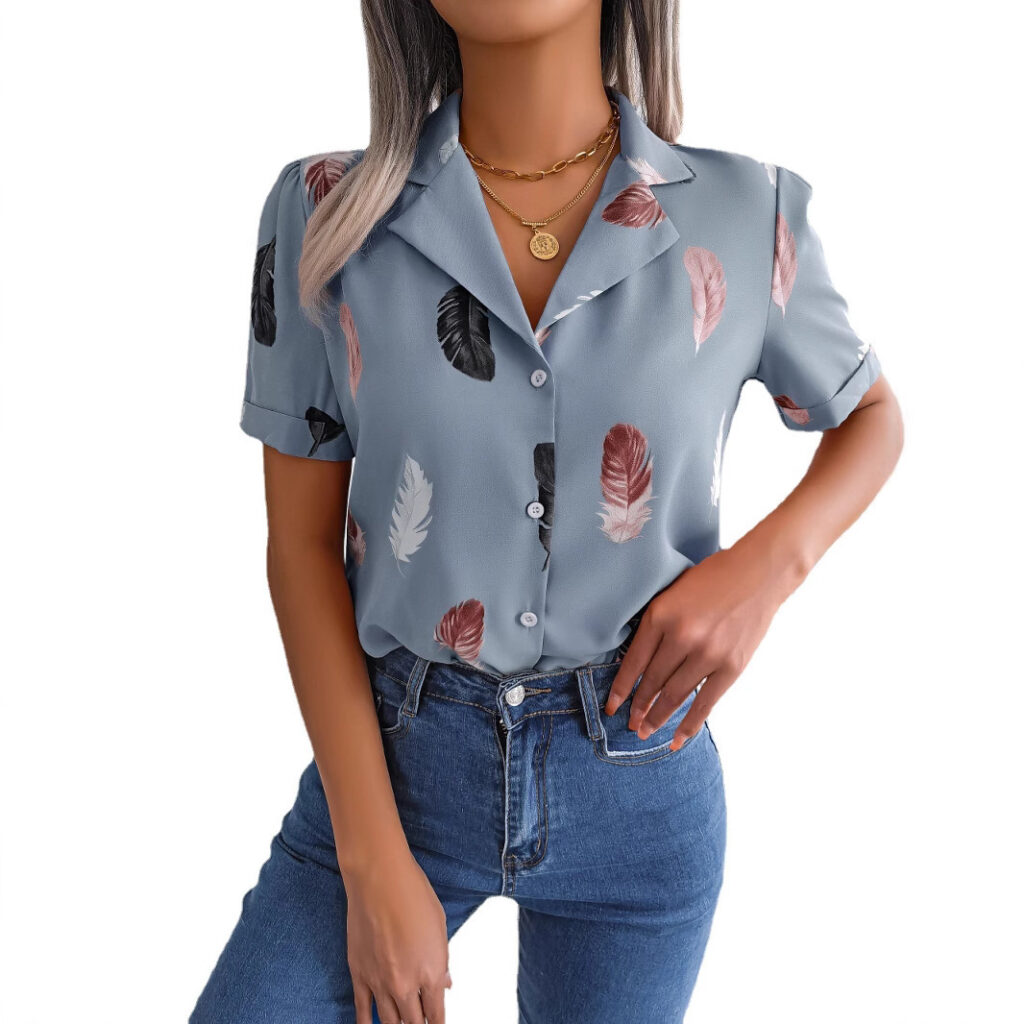Woman wearing feather-patterned blouse and jeans.