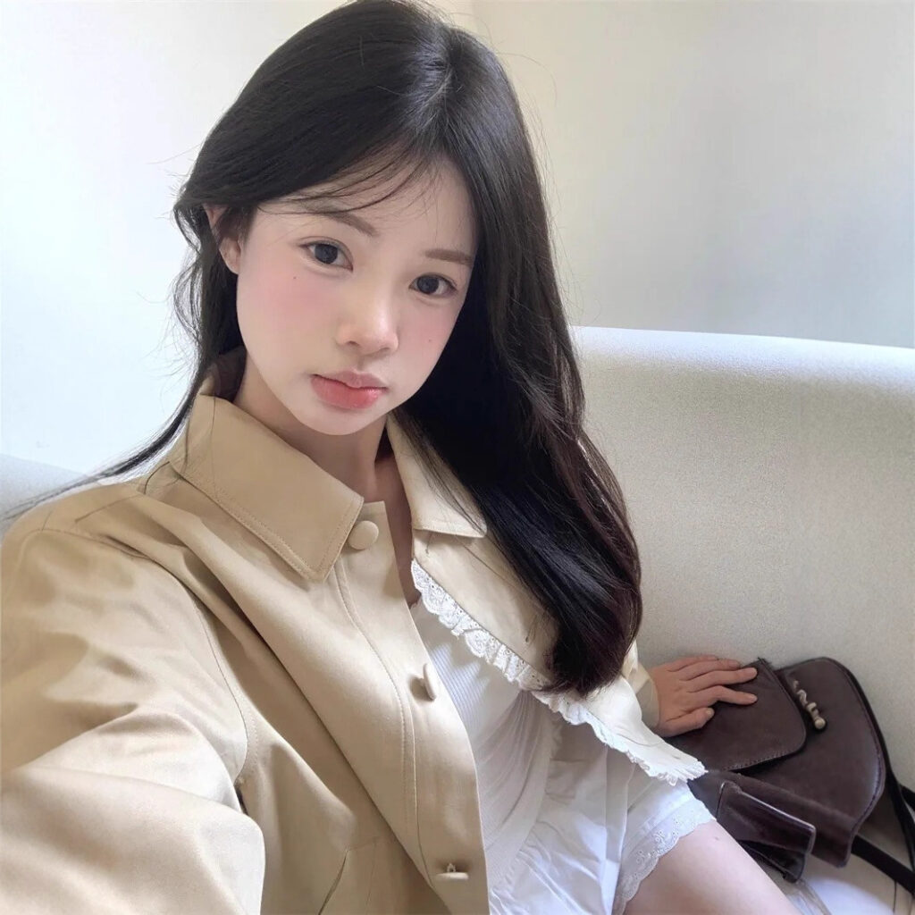 Young woman sitting on a sofa.