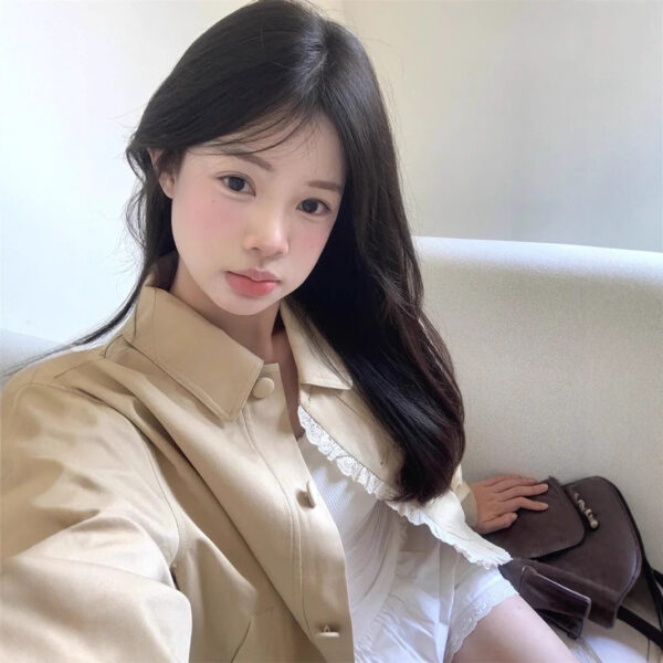 Young woman sitting on a sofa.
