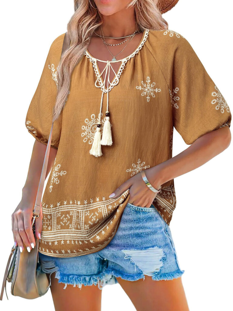 Woman wearing boho blouse and denim shorts.