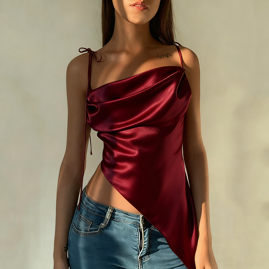 Woman in red silk asymmetric top.