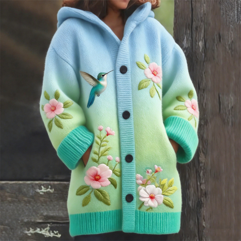 Child wearing floral embroidered colorful coat.