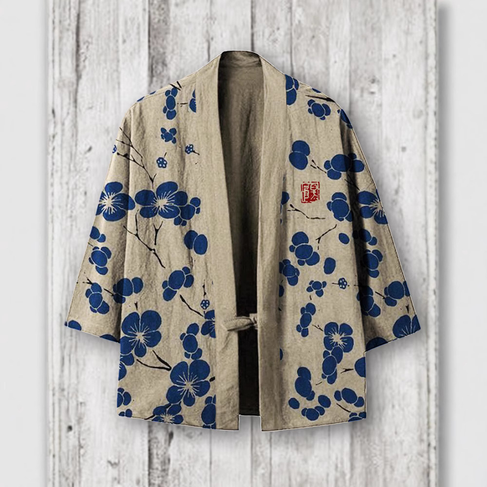 Beige kimono jacket with blue floral pattern.