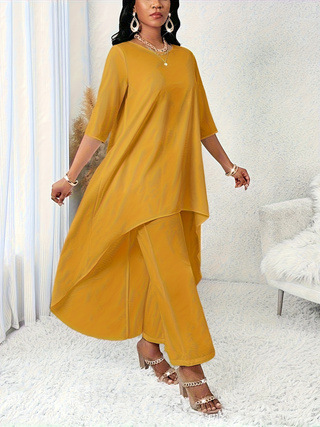 Woman in mustard yellow asymmetrical outfit.