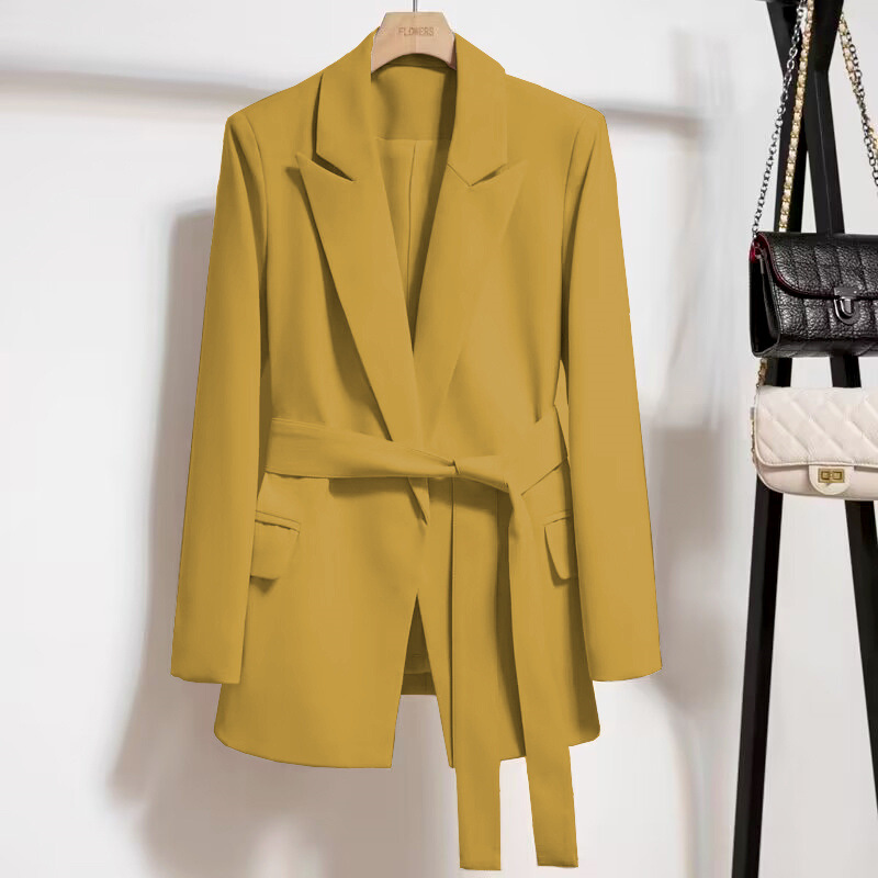 Yellow blazer with belt on hanger.