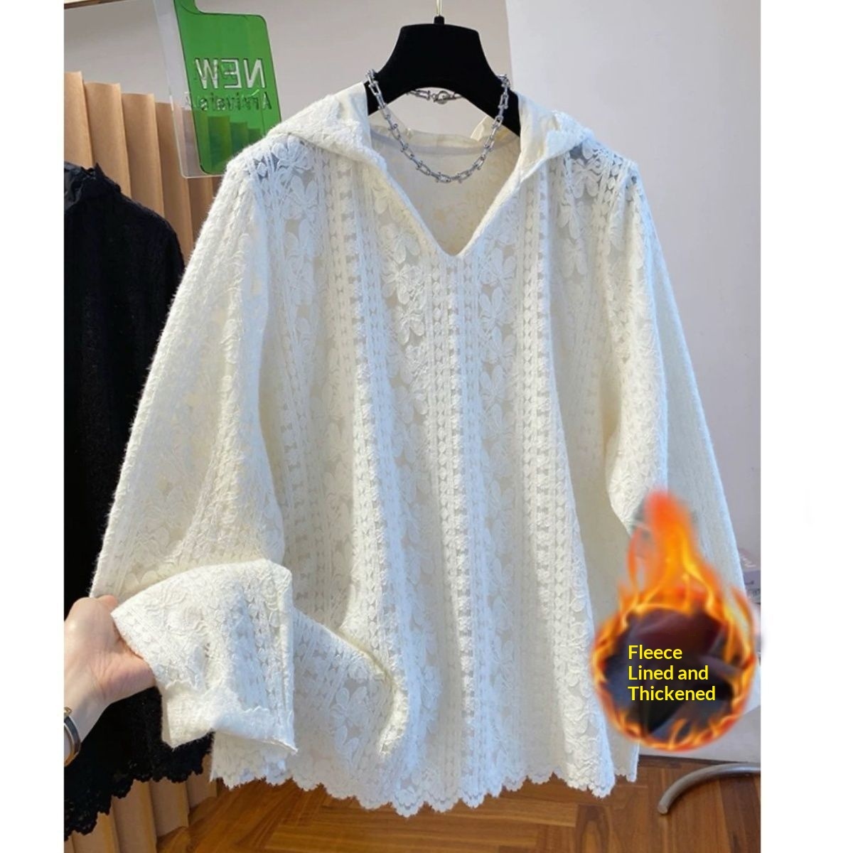 White lace sweater with fleece lining displayed.