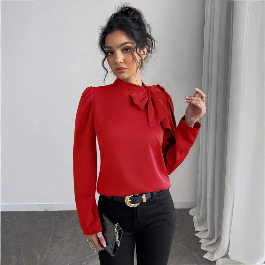 Woman in red blouse with bow.