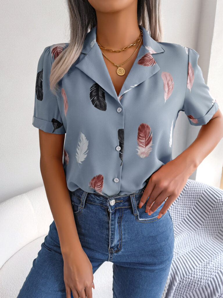 Woman in feather-print shirt and jeans.