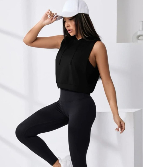 Woman in athletic wear and white cap.