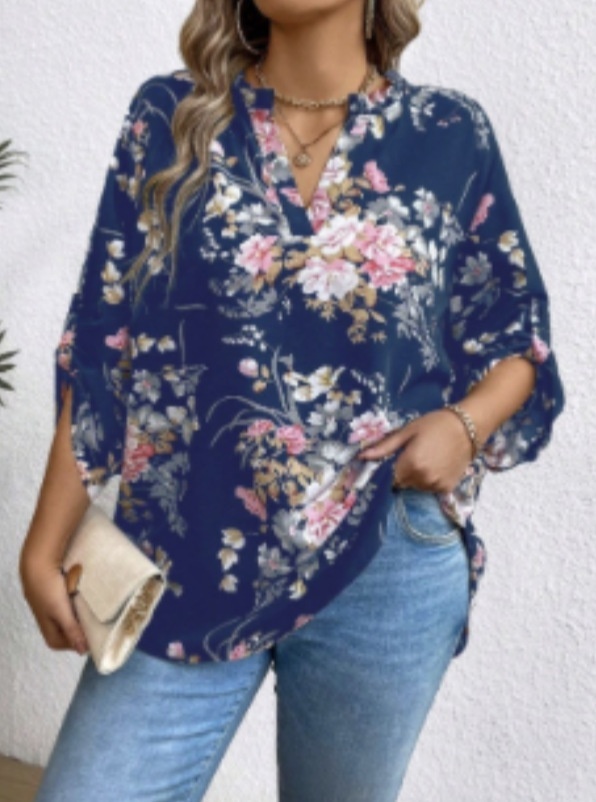 Woman in floral blouse with jeans.
