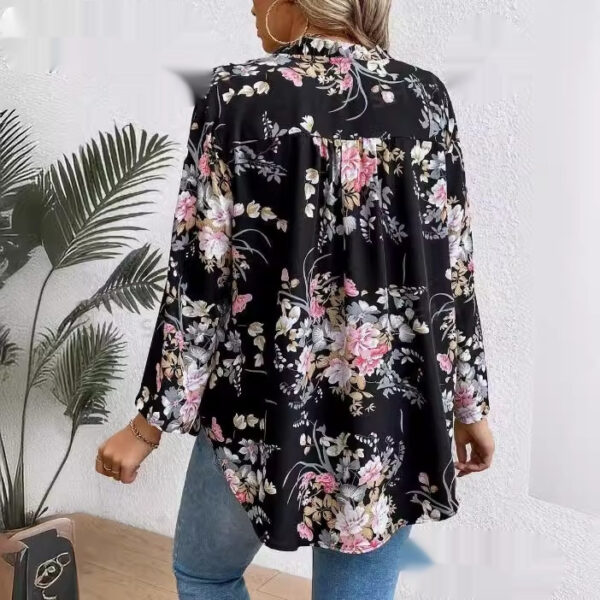 Woman wearing floral blouse and jeans.