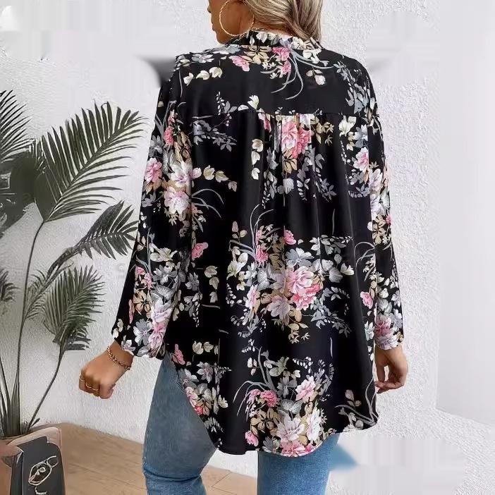 Woman wearing floral blouse and jeans.