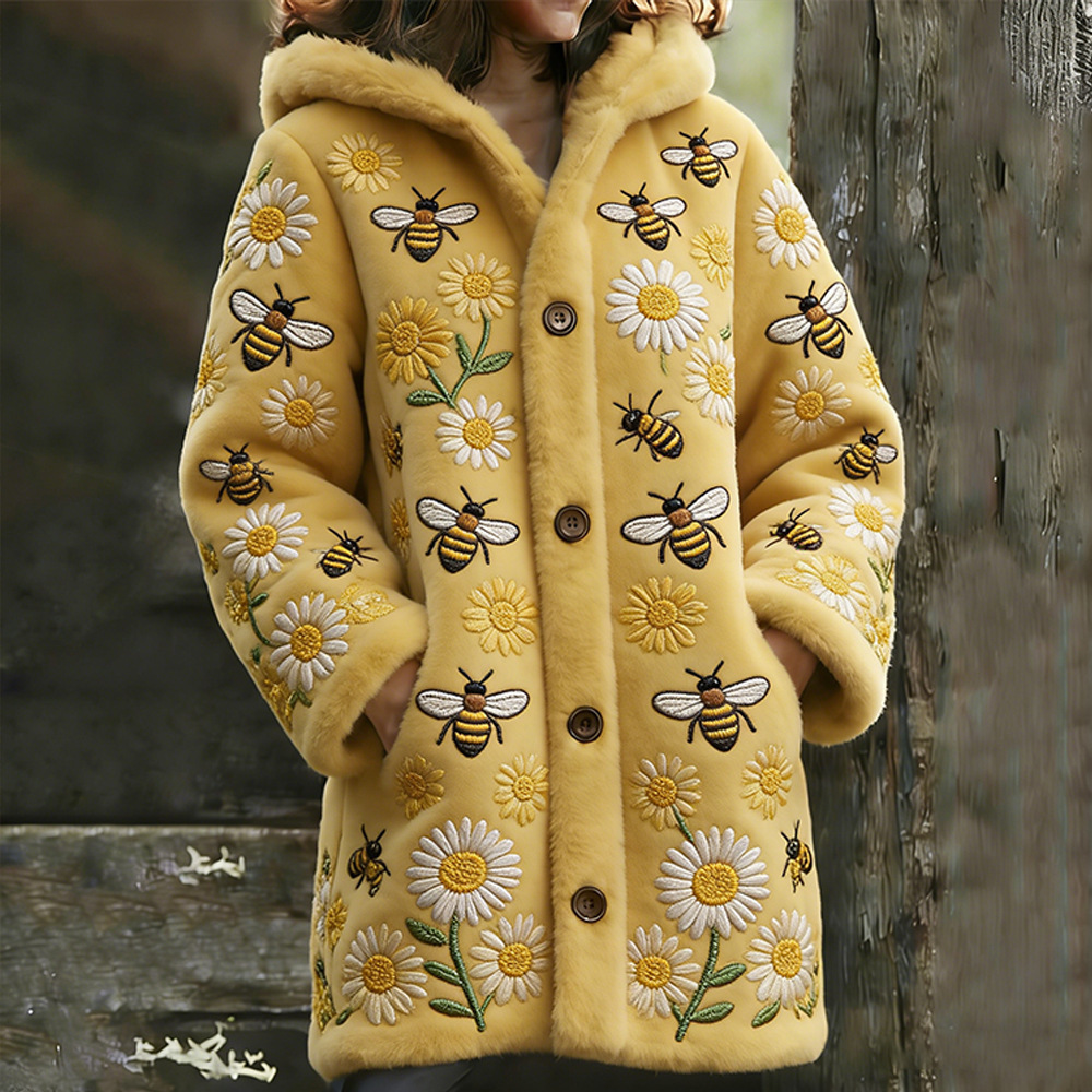 Yellow coat with bee and flower embroidery.