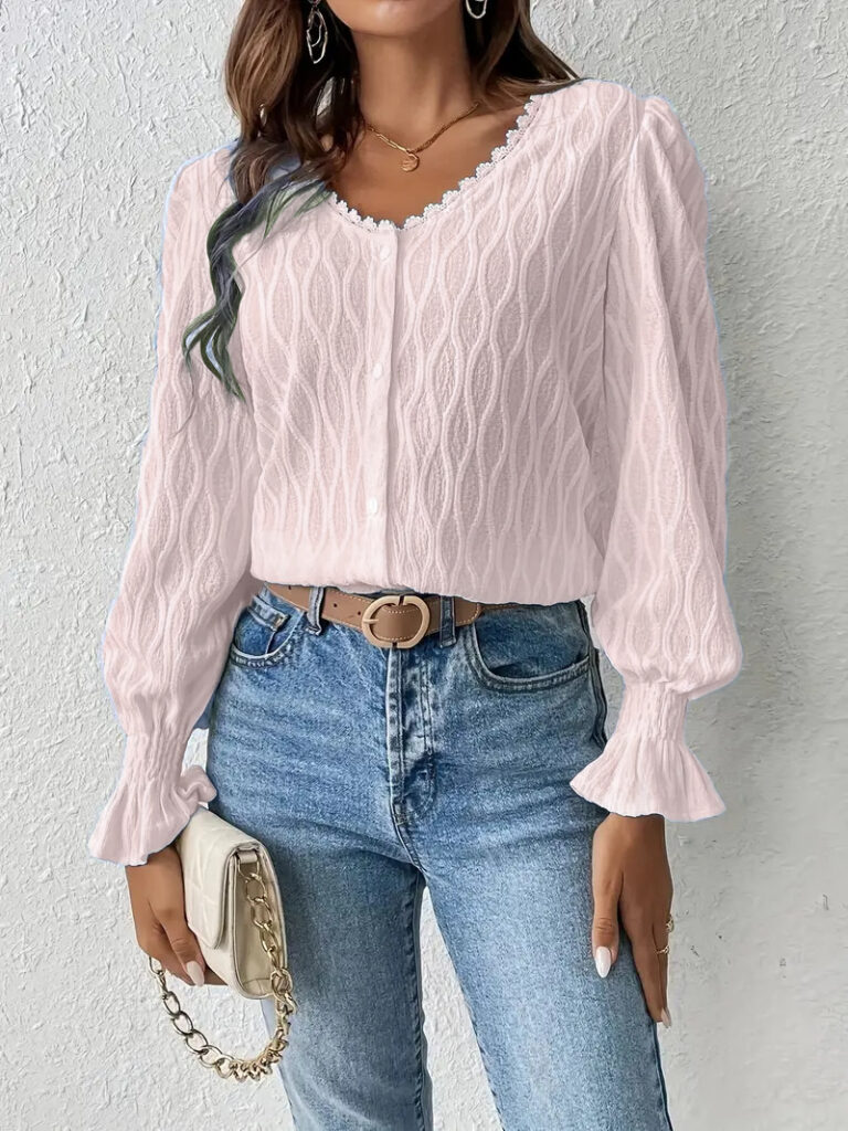 Woman in pink blouse and jeans outfit.