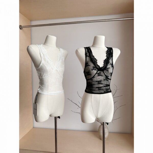 White and black lace tops on mannequins.