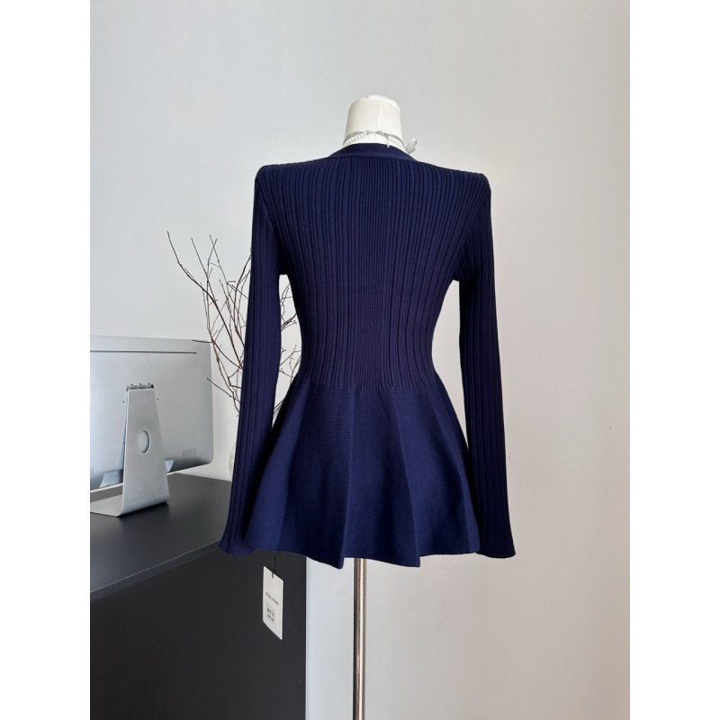 Navy ribbed sweater on mannequin.