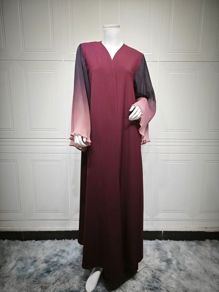 Mannequin displaying elegant long-sleeve dress.