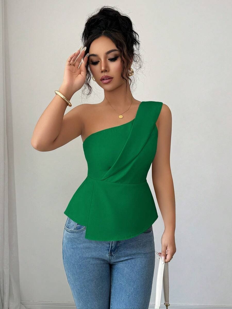 Woman in green top and jeans.