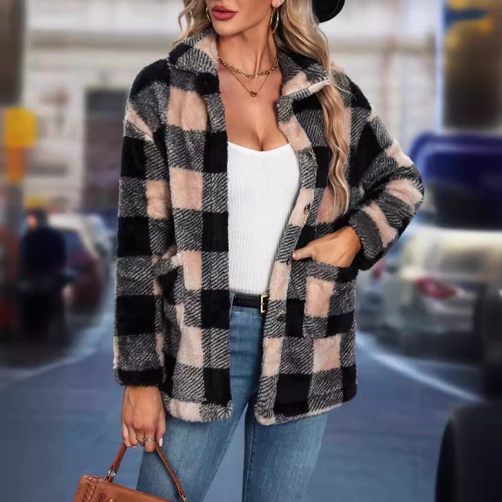 Woman in checkered coat, holding a purse.