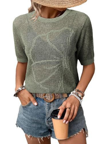 Woman in green sweater holding coffee cup.