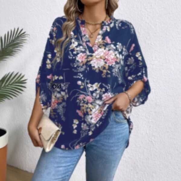 Woman in floral blouse and jeans outfit.