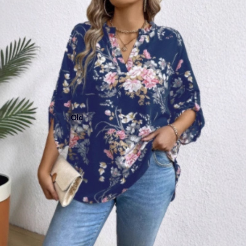 Woman in floral blouse and jeans outfit.
