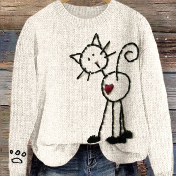Sweater with cute cat and heart design.